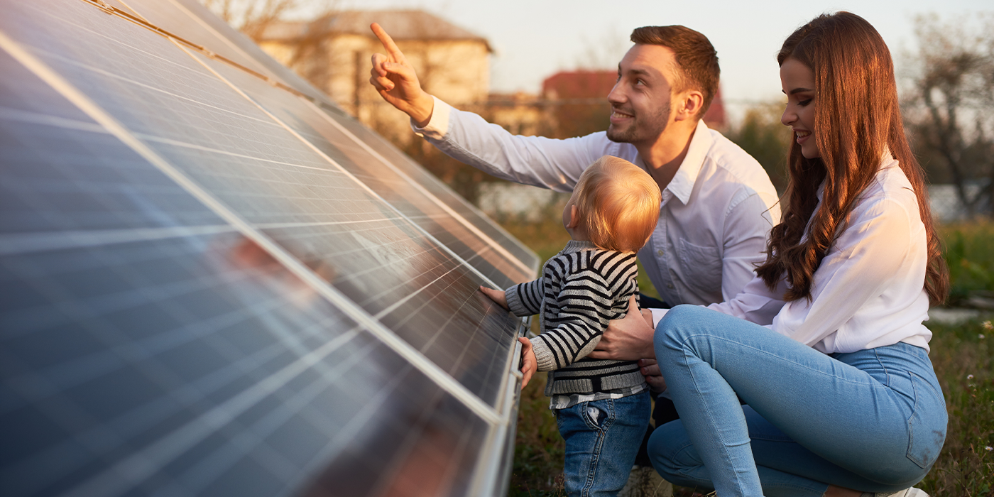 Family looking at solar panels 