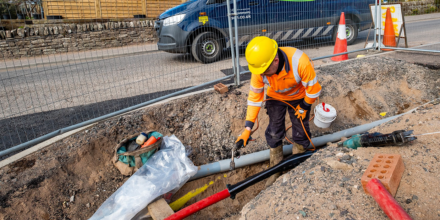 Engineer finishing connection with shring wrap