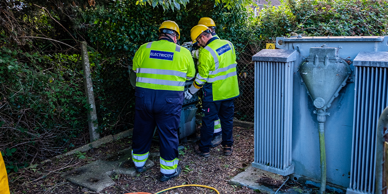 Engineers working inside a substation