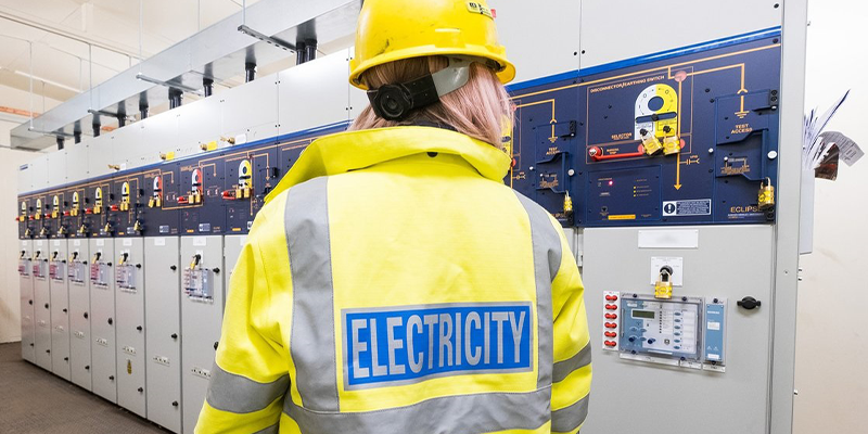 SSEN Engineer inside substation looking at equipment 