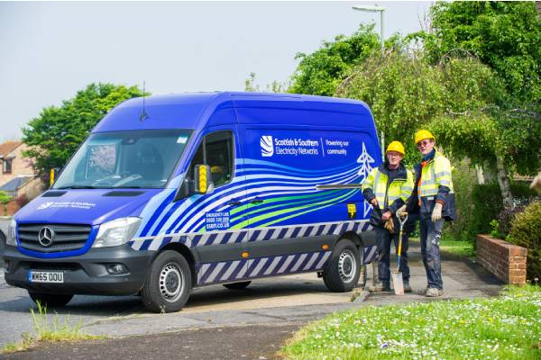 ssen van parked with engineers standing behind with shovels