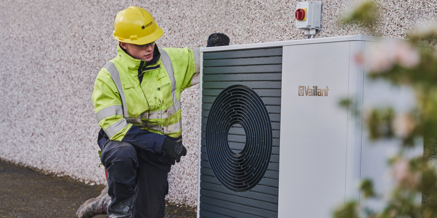 Image of engineer with heat pump